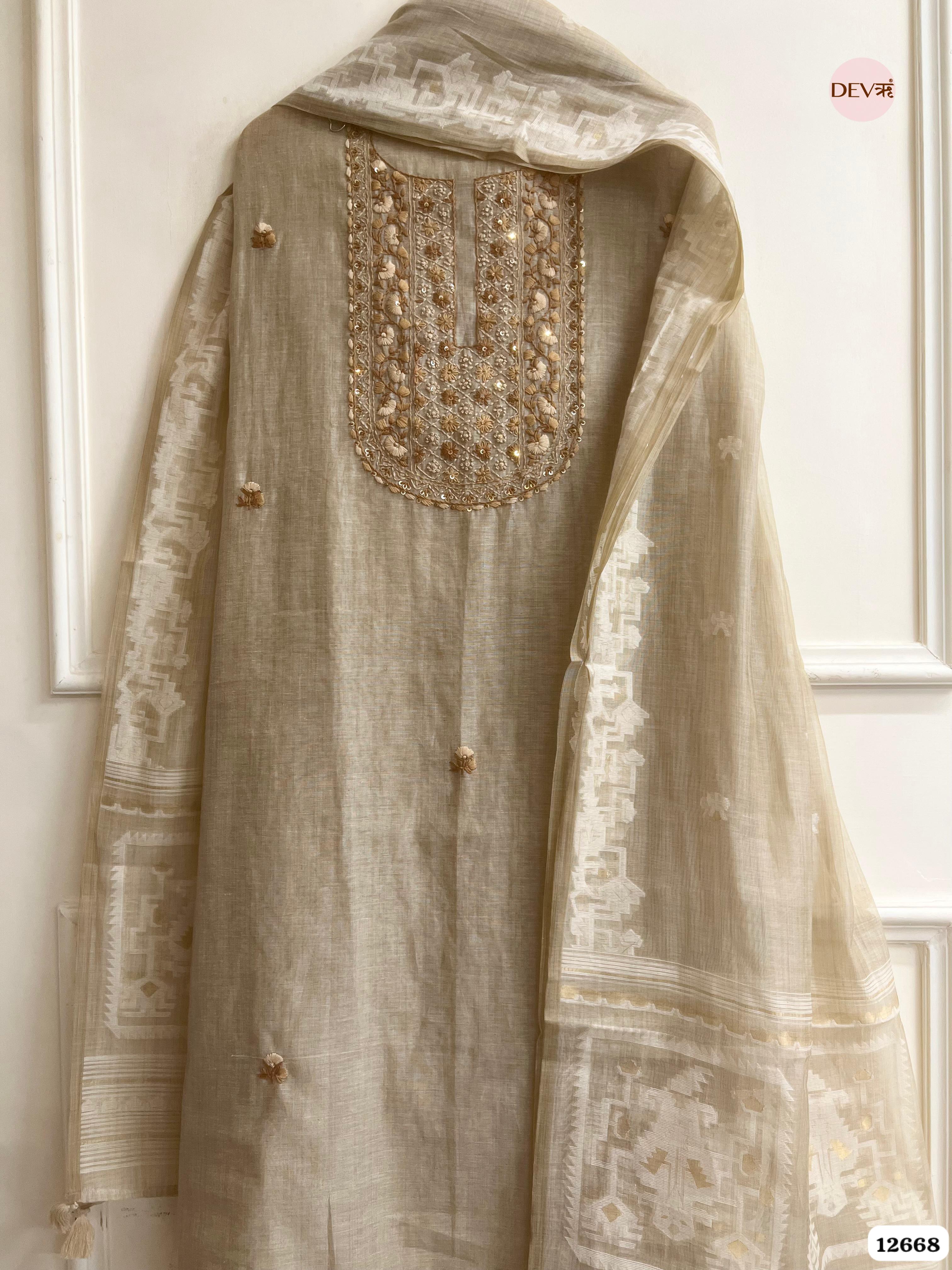 Beige Mul Chanderi Embroidered Unstitched 3-Piece Suit (Devri – D.No 12668)